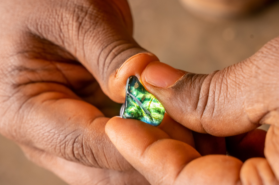 Gands holding an Australian Fura mined sapphire