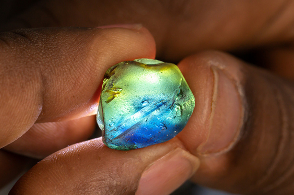 Australian sapphires in a range of dark blue and parti colors displayed for the wholesale market